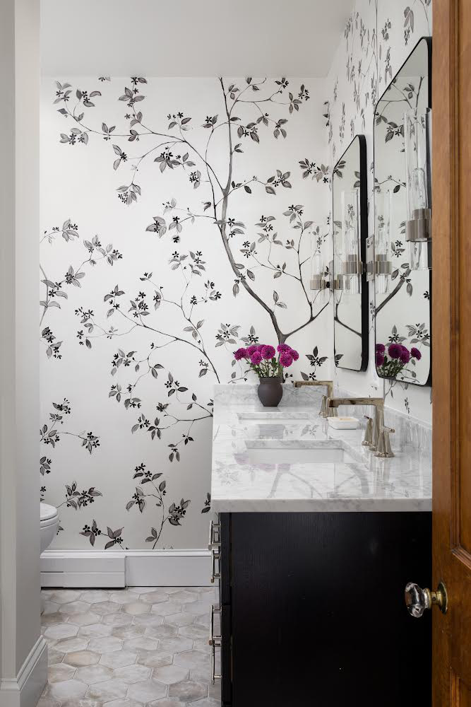 Inspired by a Schumacher wallpaper, this springtime tree mural was hand-painted with Golden Paintworks Slow Dry Fluid Acrylics on canvas. The renovated master bath, located in an early 1900's home in suburban Baltimore, was designed by Laura Hodges Studio.