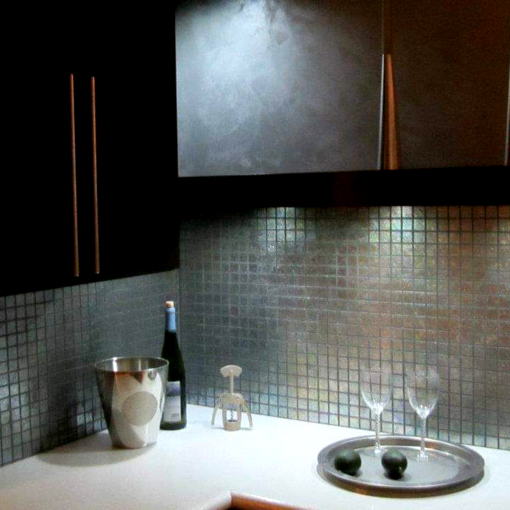 Hand troweled tile finishes, all hand taped and extremely durable have been displayed in several cabinet and kitchen shops in my area for great and easy marketing.  A foil finish was used to create this mini mosaic.