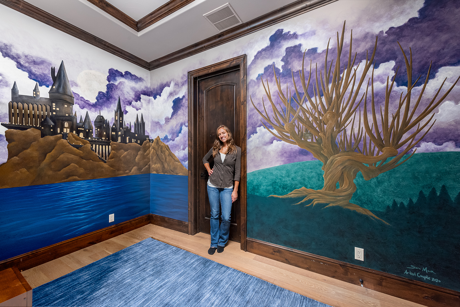 A custom designed Harry Potter-themed mural we painted, featuring the mythical castle of Hogwarts and a Whomping Willow.