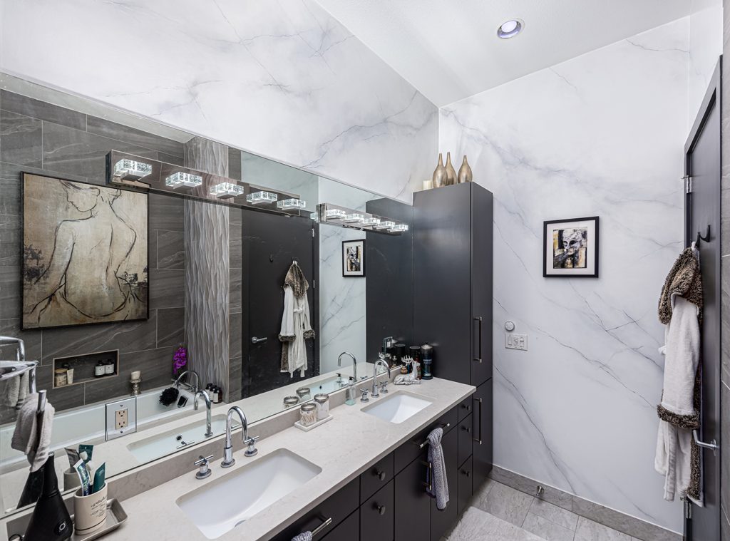 An upscale project we did for a penthouse in downtown Austin, TX. We
started with very rough wallpaper stripped walls, floated them to level-5 finish and created beautiful faux-marble walls that feature the world’s mirroriest mirror chrome paint veining and a white sparkle ceiling.