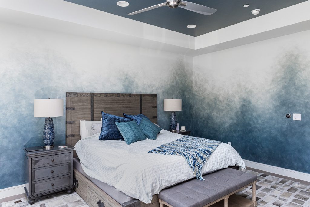 A sophisticated Ombre accent wall we created for a luxurious home in Austin, TX. The client was so happy with how it turned out they hired us back to create custom two-tone metallic ceilings in the bedroom and bathroom and a Venetian Plaster accent wall in their entryway.