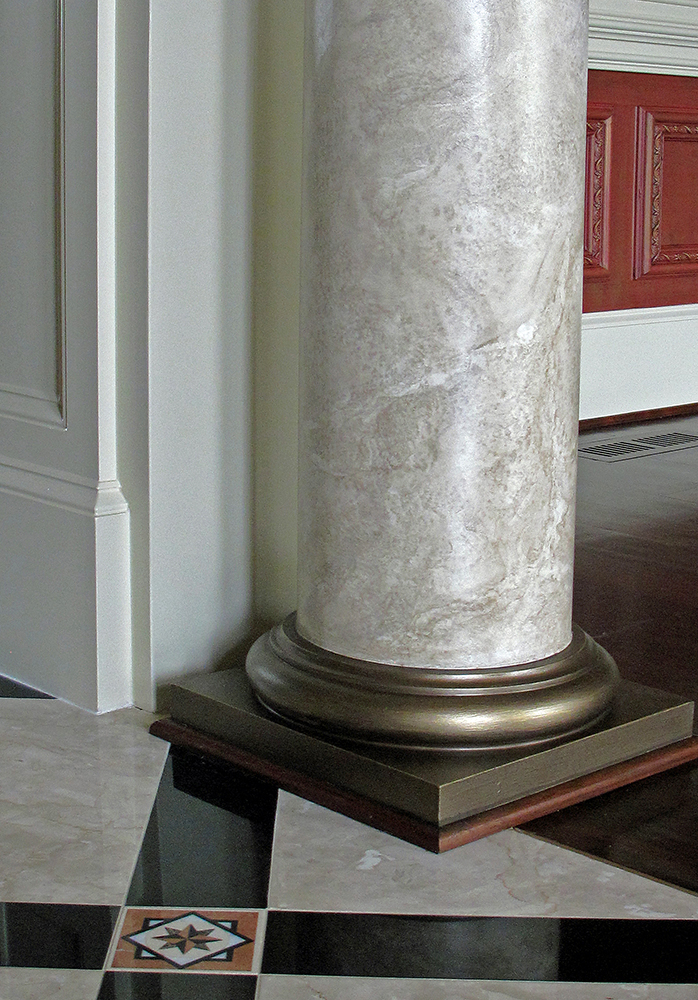 The goal was to paint the columns to create an upward extension of this natural element.