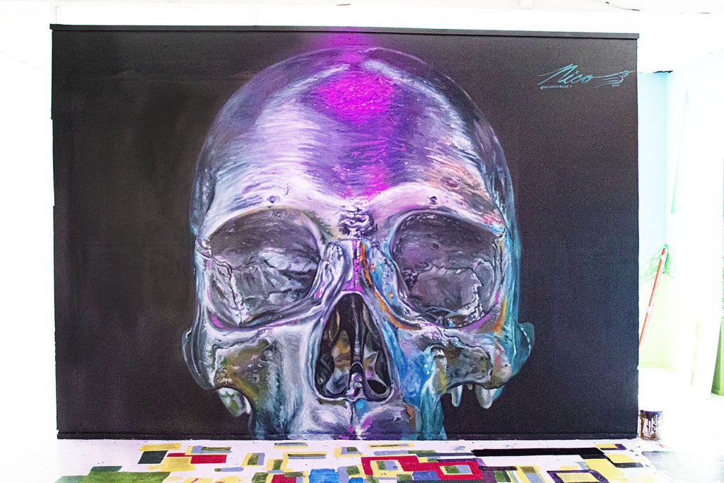"A Reflection Of My Peers". This piece was created for the exhibition that is the kickoff to the Newport News Street Museum. The piece shows a chromed skull which is reflecting the other artwork and lighting in the gallery.
