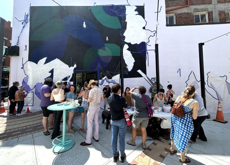 Around 500 people, locals and visitors, painted a portion of the The Hidden Gem community painting over the course of two days.