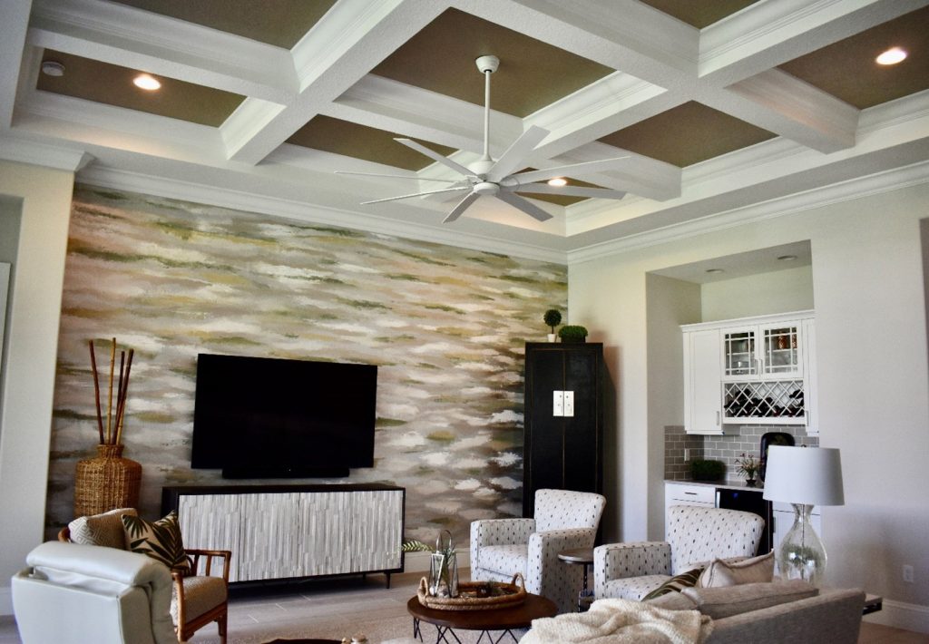 This client's room was dark without a lot of natural light or cohesion of the various colors in the room. I created this abstract wall and ceiling finish with different metallic paint colors and various textures of plaster to give depth, texture and to tie everything together.