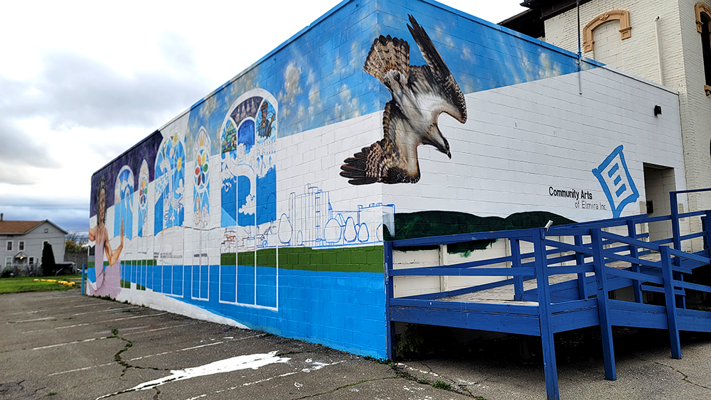 I chose to include an Osprey on the front corner of the building. These birds hunt and nest along the Chemung River that flows through Elmira, and have inspired many local artists, appearing in other murals and a statue in the area.